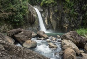 Landscape view of the silky flow of water of Tinago Falls